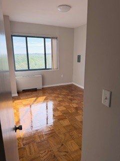 Laurel apartment for rent - A room with a window and a radiator on the wall.