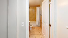 Riverdale apartment for rent - a bathroom with a toilet and a bathtub