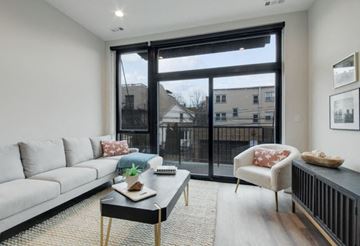 Chicago apartment for rent - a living room with a large window and a couch