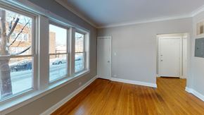 Chicago apartment for rent - a living room with wood floors and large windows