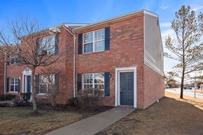 Monroe apartment for rent - A red brick house with a black door and a small porch.
