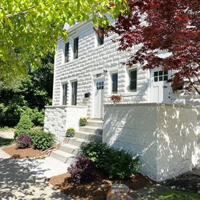 Detroit apartment for rent - a white house with a tree in front of it