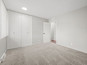 Ypsilanti apartment for rent - a bedroom with white walls and carpet