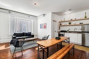Detroit apartment for rent - A kitchen with a table and chairs in the middle of the room.