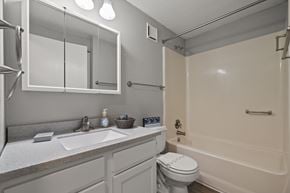 Monroe apartment for rent - A bathroom with a sink, toilet, and bathtub.