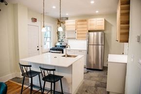 Detroit apartment for rent - a kitchen with a white counter top and a stainless steel refrigerator