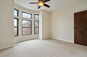Detroit apartment for rent - an empty bedroom with a ceiling fan