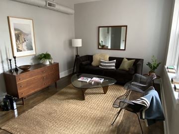 Detroit apartment for rent - a living room with a couch and a coffee table