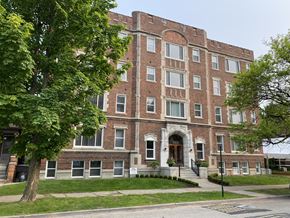 Detroit apartment for rent - a red brick building with a tree in front of it