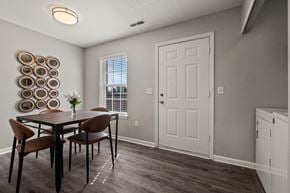 Monroe apartment for rent - A dining room with a table and chairs.