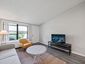 Sterling Heights apartment for rent - the living room of an empty apartment with wood flooring