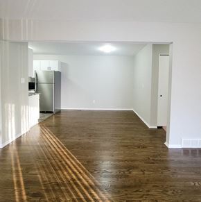 Ferndale apartment for rent - an empty living room and kitchen with a wood floor