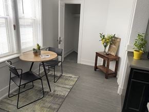 Detroit apartment for rent - a small dining room with a table and chairs and a hallway