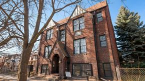 Detroit apartment for rent - a large brick building with a tree in front of it