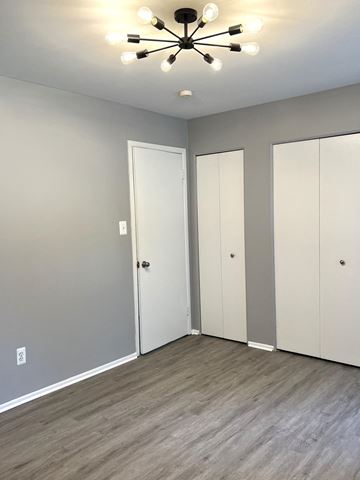 Ferndale apartment for rent - a bedroom with two closets and a ceiling fan