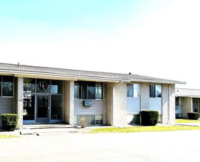 Ypsilanti apartment for rent - the front of a white building with a black door