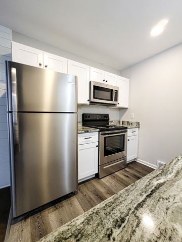 Ferndale apartment for rent - a kitchen with stainless steel appliances and white cabinets