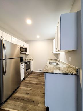 Ferndale apartment for rent - a kitchen with stainless steel appliances and a marble counter top