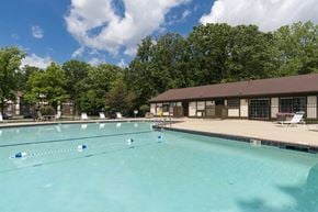 Newport apartment for rent - A large swimming pool with blue lane markers and a building in the background.