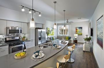 Scottsdale apartment for rent - furnished kitchen and living room with stainless steel appliances and a large island