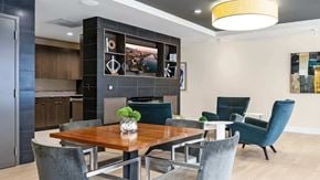 Portland apartment for rent - A modern dining room with a wooden table and grey chairs.