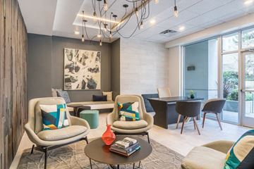Bellevue apartment for rent - a living room and dining room with chairs and a table