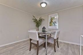 Tampa apartment for rent - A dining room with a table and chairs.