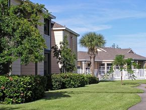 Vero Beach apartment for rent - A building with a white picket fence in front of it.