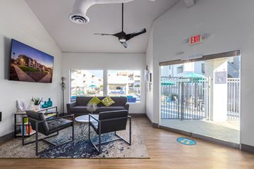 Tempe apartment for rent - a living room with a couch and a coffee table and a sliding glass door