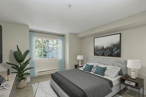 Everett apartment for rent - a bedroom with a large bed and a large window