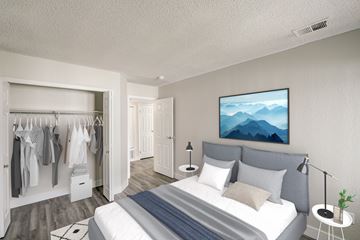 Golden apartment for rent - a bedroom with a bed and a closet