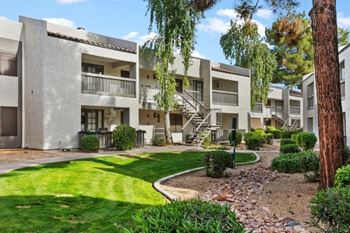 Lush landscaping with lawns throughout