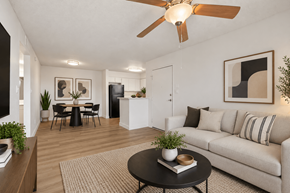 Tempe apartment for rent - A living room with a couch, a dining table, and a ceiling fan.