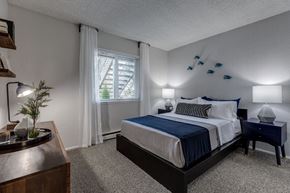 Renton apartment for rent - a bedroom with a bed and a window