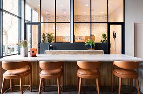 Fremont apartment for rent - A modern kitchen with a long island and four chairs.