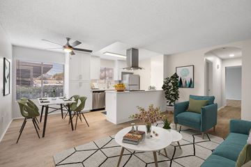 Vista apartment for rent - an open living room and kitchen with a table and chairs