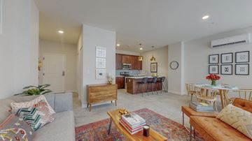 Albany apartment for rent - a living room with a couch and a table and a kitchen