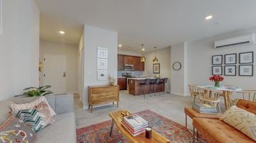 Albany apartment for rent - a living room with a couch and a table and a kitchen