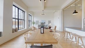 Schenectady apartment for rent - a dining room with wooden tables and chairs and a large window