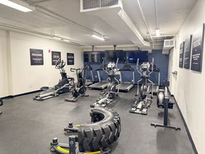 Albany apartment for rent - A gym with a variety of exercise equipment including treadmills, stationary bikes, and weight machines.