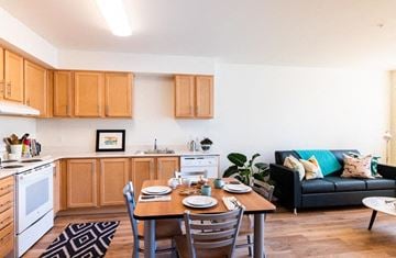 Seattle apartment for rent - a living room with a kitchen and a dining table
