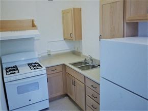 Seattle apartment for rent - a kitchen with a stove sink and refrigerator at Cambridge Apartments, Seattle, 98101