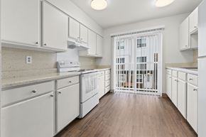 Seattle apartment for rent - A kitchen with white cabinets and a white oven.