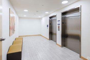 Stainless steel elevators and a row of chairs