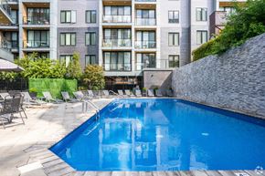 Philadelphia apartment for rent - A swimming pool in front of a residential building.