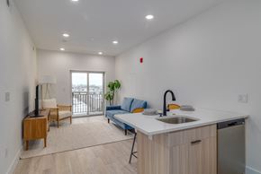 Philadelphia apartment for rent - A kitchen area with a sink, a counter, and a window.