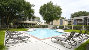 Houston apartment for rent - our apartments have a large pool and lounge chairs