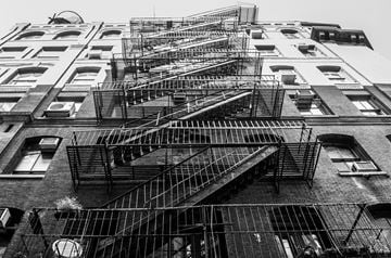 New York apartment for rent - fire escapes on the side of an apartment building
