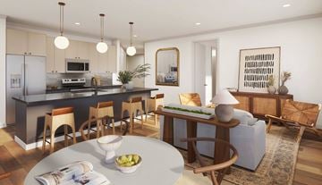Louisville apartment for rent - A modern kitchen with a dining table and chairs.