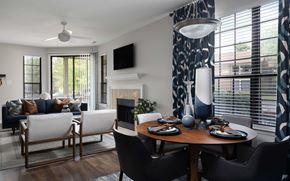 Indianapolis apartment for rent - A modern dining room with a wooden table and chairs.